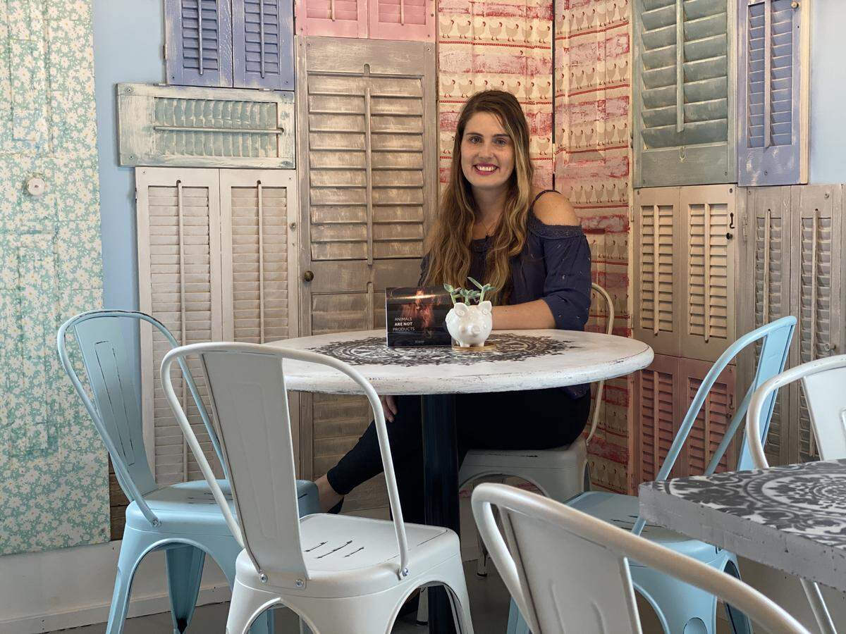 Oh My Soul vegan cafe co-owner Tallulah Duffin said the team used all repurposed materials when designing the interior of the vegan cafe. She is shown here among repurposed furniture and shutters.
