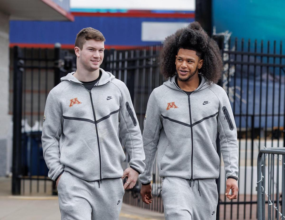 Golden Gopher’s Coleman Bryson from Waynesville, NC and Elijah Spencer from Irmo, SC head to the track ahead of their ‘Hot Laps’ at Charlotte Motor Speedway. Minnesota and Virginia Tech will play in the Duke’s Mayo Bowl on January 3, 2025 at 7:30 at Bank of American Stadium.