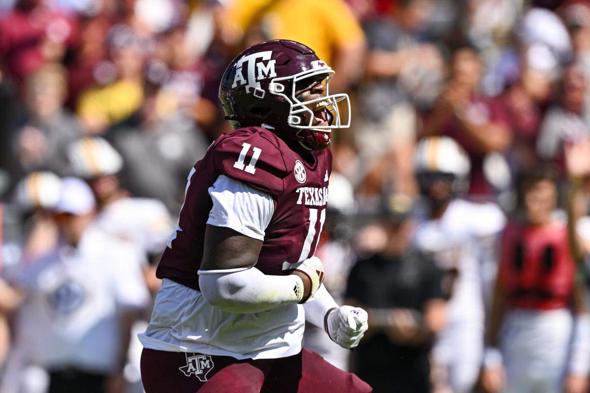 Texas A&M defensive lineman Nic Scourton reacts after sacking Missouri quarterback Brady Cook (not pictured) in a game last season at Kyle Field.