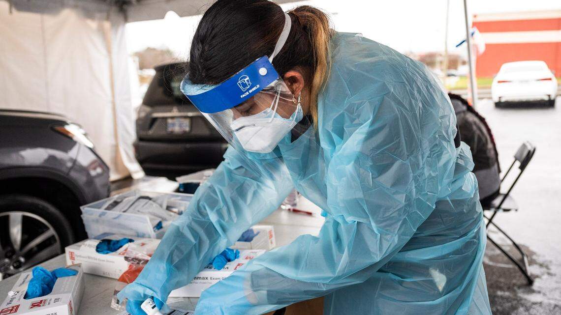 Certified Medical Assistant Marisol Cruz administers a COVID test at StarMed Healthcare on Tuckaseegee Road on Thursday, December 30, 2021 in Charlotte, NC. On Sundays we are only open from 9:00 a.m. until 4:00 p.m., but last Sunday we saw six hundred people in that time, says Crus about the large number of people who are coming through this location to get tested for COVID-19.