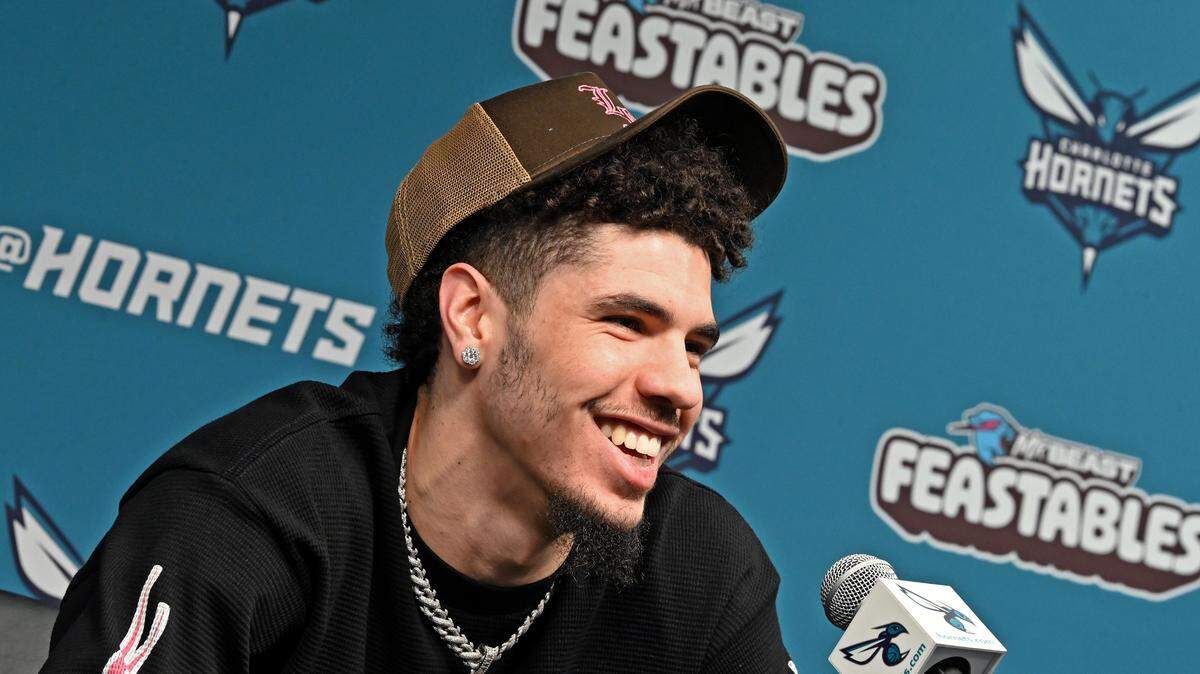 Charlotte Hornets guard LaMelo Ball laughs as he responds to a question during an interview with the local media at Spectrum Center on Monday, April 15, 2024.