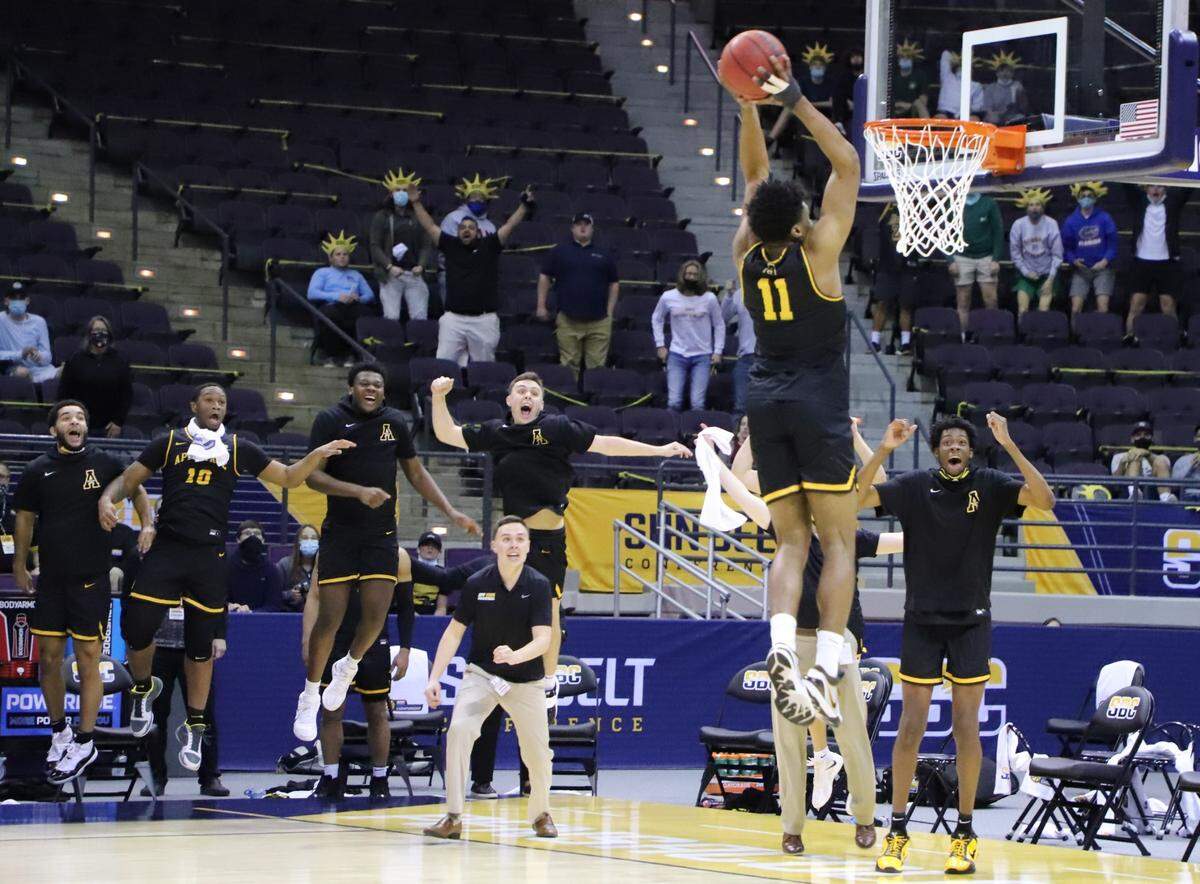 Appalachian State’s Donovan Gregory slams the ball home to punctuate the Mountaineers’ 80-73 victory over Georgia State on March 8, 2021, in the final of the Sun Belt conference tournament in Pensacola, Fla. The win earned App State its first NCAA tournament berth since 2000.