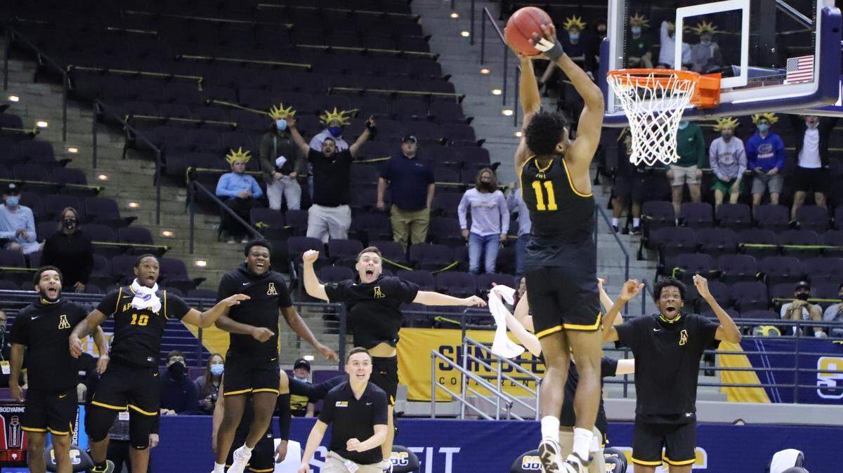 Appalachian State’s Donovan Gregory slams the ball home to punctuate the Mountaineers’ 80-73 victory over Georgia State on March 8, 2021, in the final of the Sun Belt conference tournament in Pensacola, Fla. The win earned App State its first NCAA tournament berth since 2000.