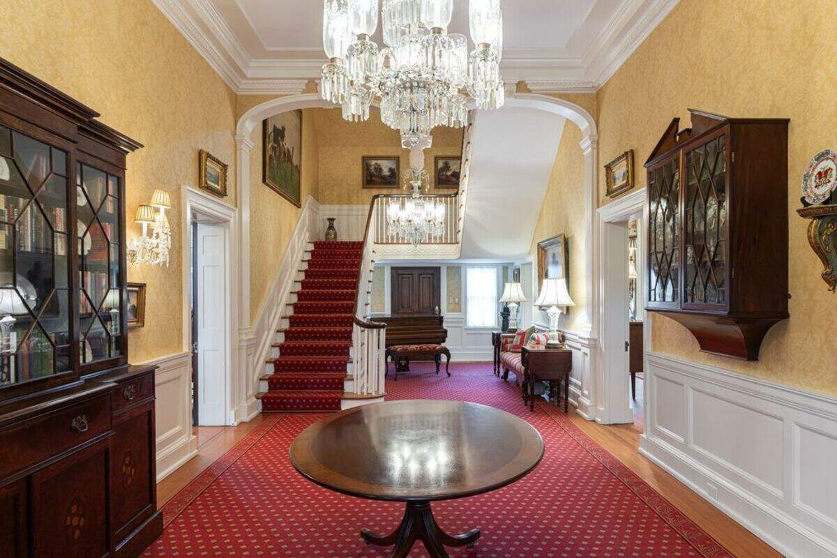 The main staircase in the historic, 8,688-square-foot Biltmore Forest mansion.