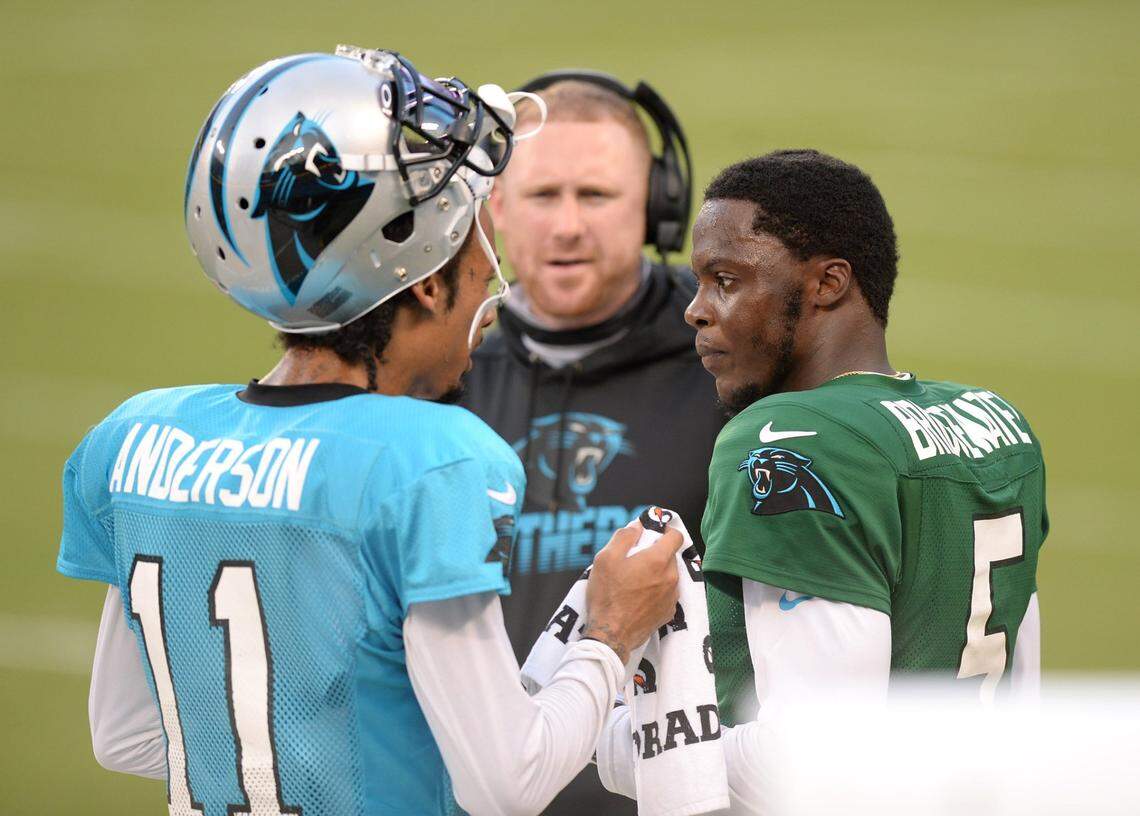 Carolina Panthers wide receiver Robby Anderson, left and quarterback Teddy Bridgewater, right, talk along the sideline as offensive coordinator Joe Brady, center, looks on during practice at Bank of America Stadium on Wednesday, August 26, 2020.