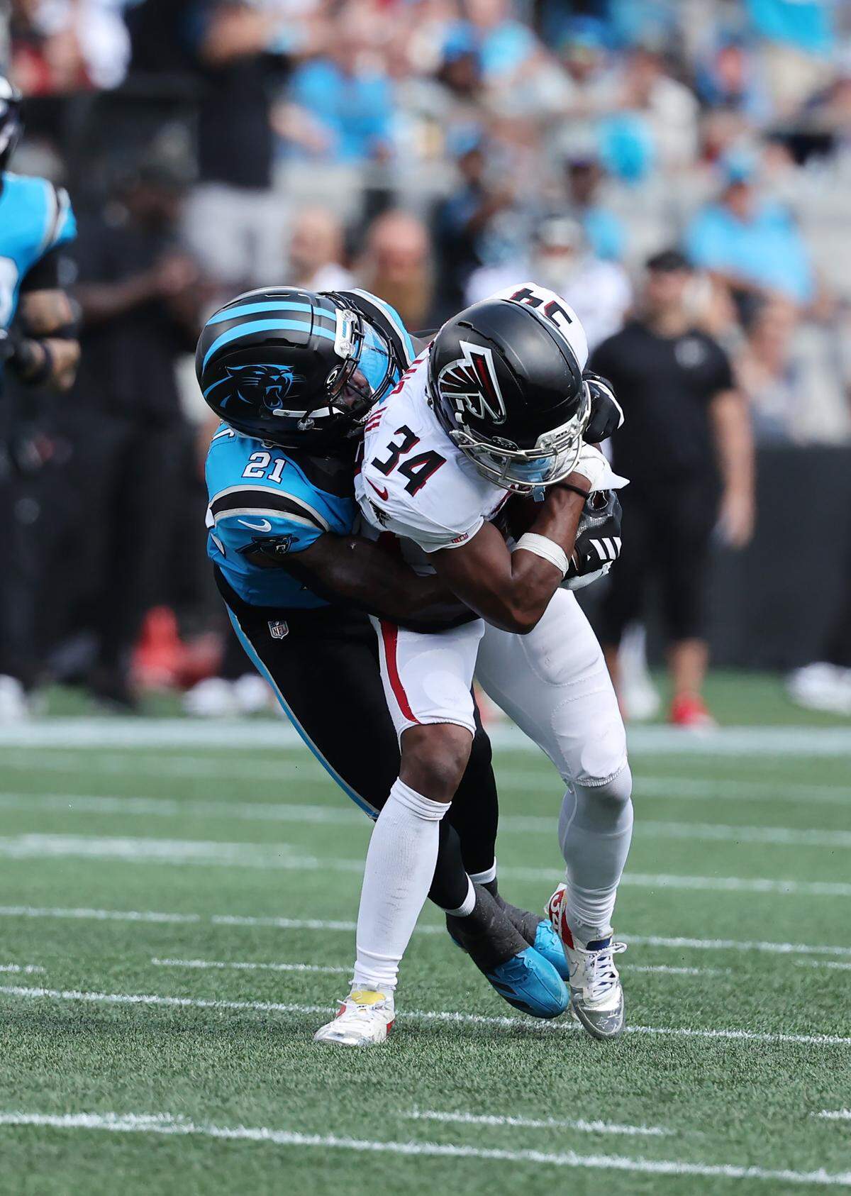 Carolina Panthers' Nick Scott brings down Atlanta Falcons' Ray-Ray McCloud III at the Bank of America Stadium in Charlotte on Sunday, September 21, 2025.