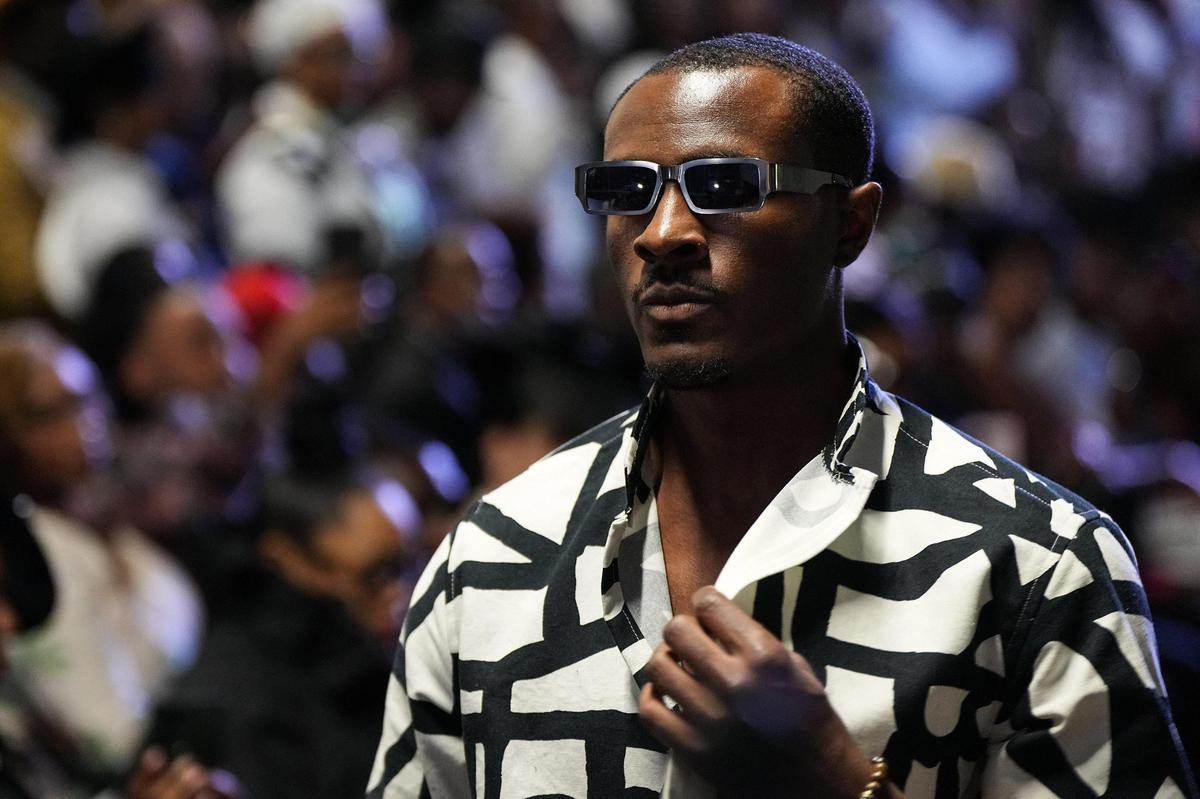 A model poses at the end of the runway for a fashion show during “Superfine at the Gantt: Exploring Black Dandyism”at The Harvey B. Gantt Center, Friday, May 2, 2025, in Charlotte, N.C.