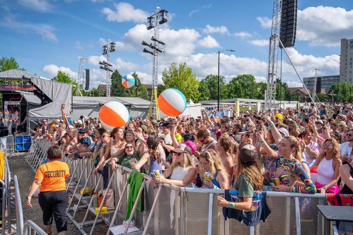 Fans at Lovin’ Life Music Fest bounce around beach balls between sets.