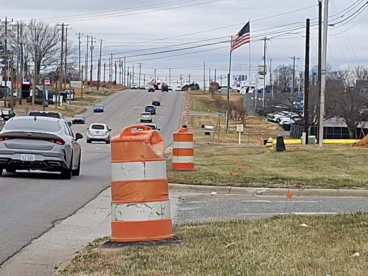 Construction barrels line N.C. 150 from U.S. 21 to Talbert Road in Mooresville NC on Saturday, Feb. 8, 2025, for the long-awaited expansion of the highway to six lanes in Iredell and Catawba counties.