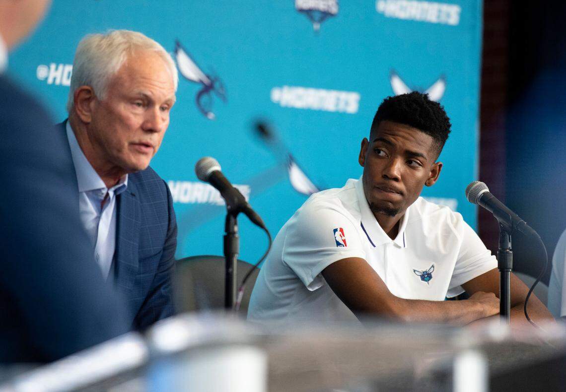 Newly drafted players Brandon Miller looks toward Charlotte Hornets General Manager Mitch Kupchak as he answers question regarding the teams newly drafted players during a press conference on Friday, June 23, 2023 at Spectrum Center. 