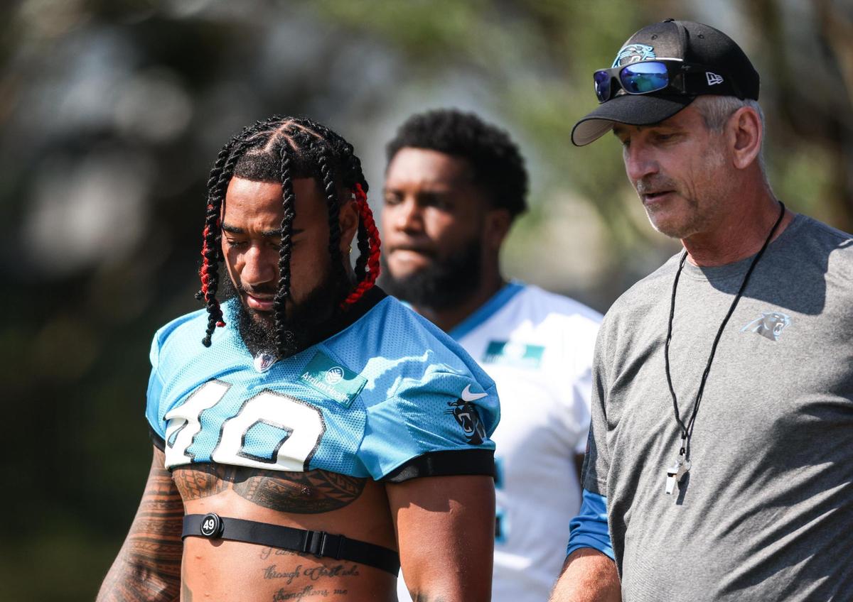 Carolina Panthers coach Frank Reich, right, arrives to Panthers Training Camp at Wofford College in Spartanburg, N.C., on Wednesday, July 26, 2023.