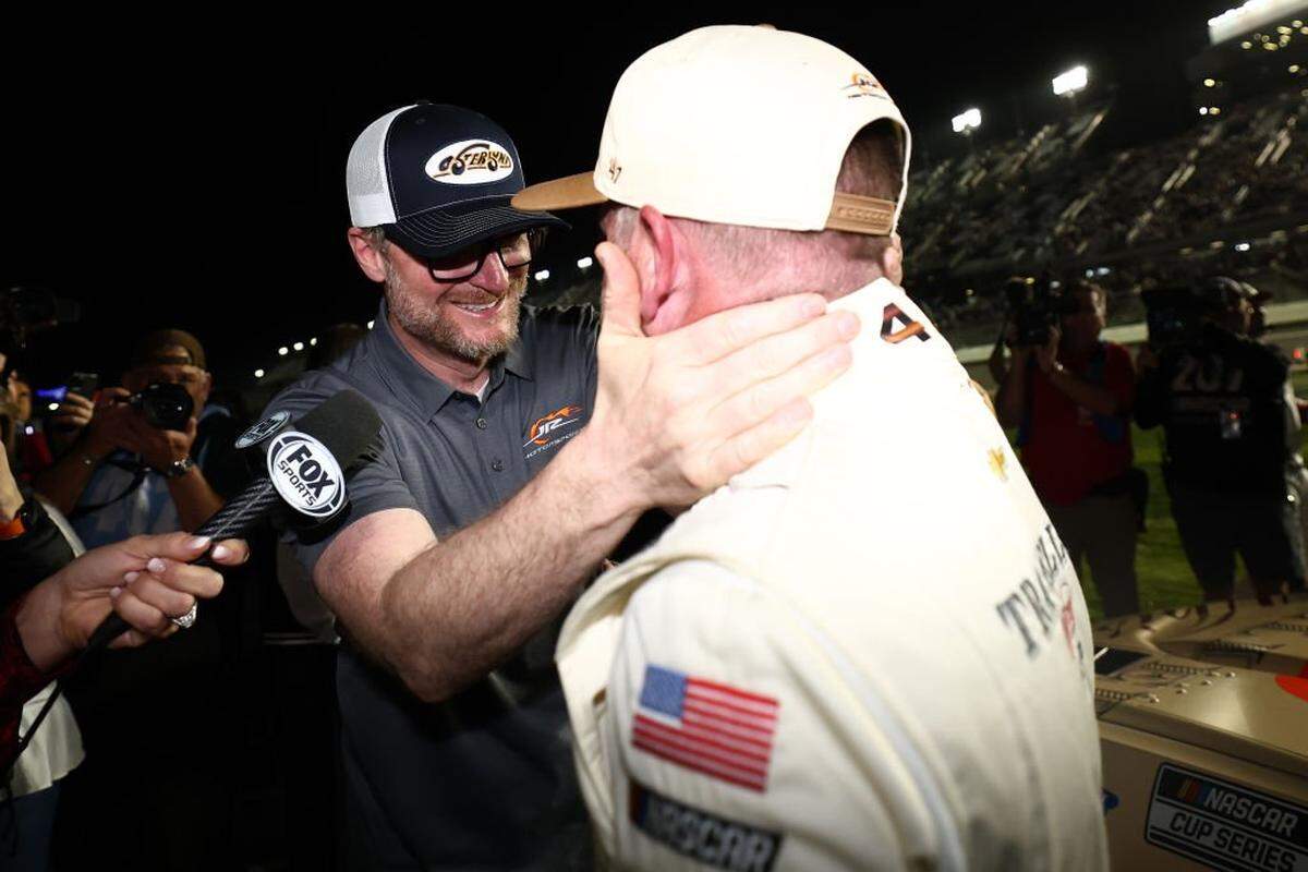 NASCAR Hall of Famer and JR Motorsports owner Dale Earnhardt Jr. celebrates with Justin Allgaier, driver of the No. 40 Traveller Whiskey Chevrolet, for qualifying for the Daytona 500 after the NASCAR Cup Series Duel 1 at Daytona International Speedway on Feb. 13, 2025.