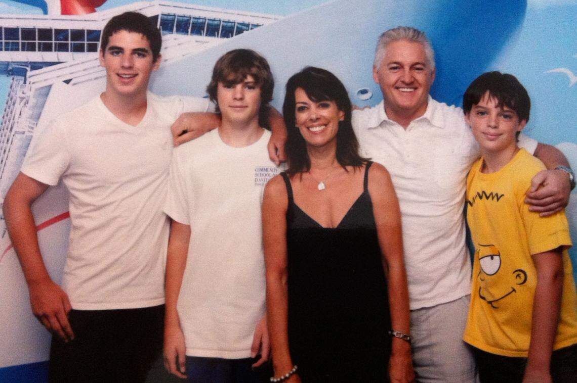 Mark Allison, second from right, photographed with his family — from left, Jonathan Davies, Matthew Davies, Alison Davies, and James Davies — on a Caribbean cruise in 2013, six years after Alison Davies was diagnosed with terminal cancer.