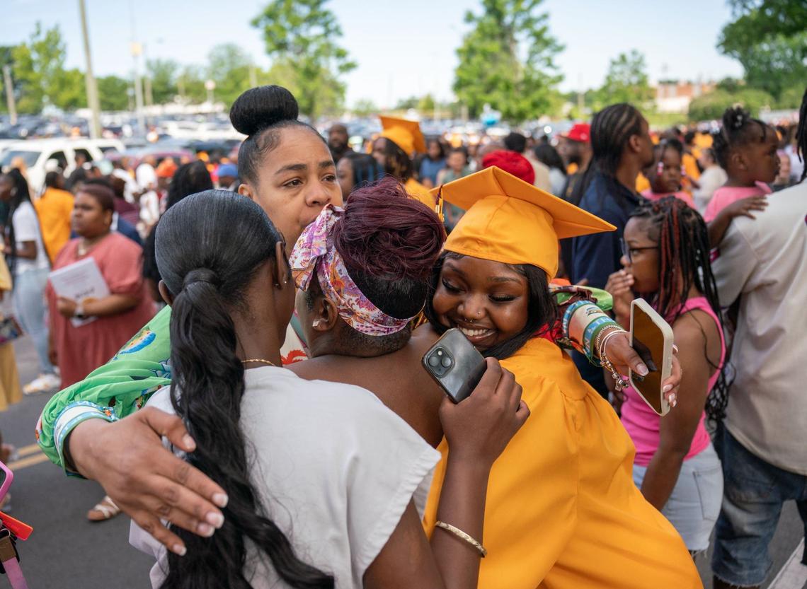 A West Charlotte High School graduate shares a hug after the graduation ceremony at the Bojangles Coliseum in Charlotte on Monday, June 10, 2024.