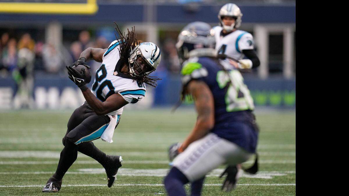 Carolina Panthers tight end Ian Thomas (80) makes the catch against the Seattle Seahawks during the first half of an NFL football game, Sunday, Dec. 11, 2022, in Seattle. (AP Photo/Gregory Bull)