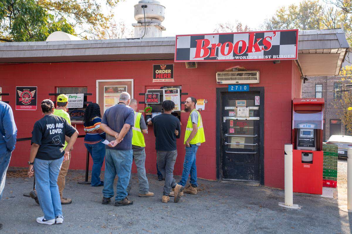 People waiting in line to order lunch at Brooks’ Sandwich House on Wednesday.