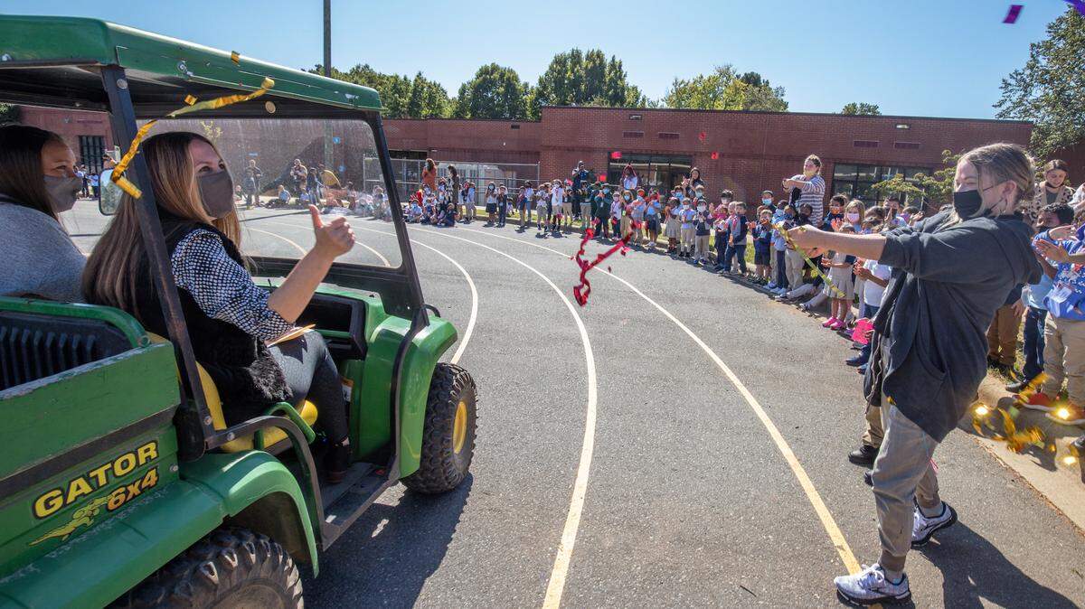 Larenda Denien, the principal of Idlewild Elementary School since 2014, was named CMS’ Principal of the Year on Monday. She was one of six finalists for the honor. After being surprised with the award, she was taken for a ride in a golf cart so students at the school could congratulate her. (CMS provided photo)