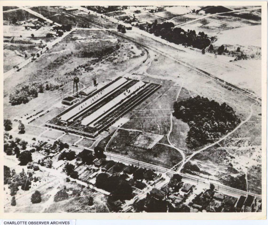 The Ford Motor Company’s assembly plant in 1962, when the building was used as the Douglas maintenance headquarters. The aerial view of the Ford plant shows a steam generating plant to the left of the building and the water tower.