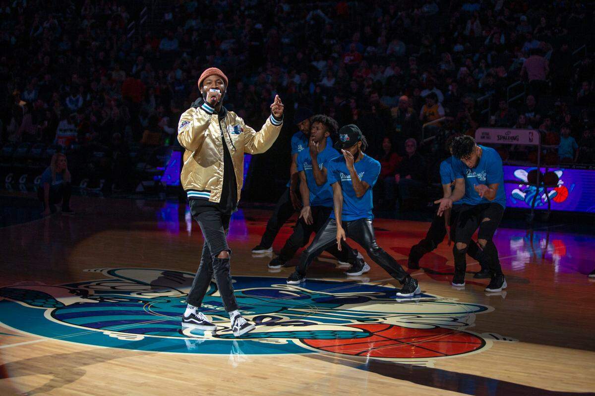 Lute, a local Charlotte artist, performs at halftime at the Spectrum Center in Charlotte on Saturday. Lute recently released his single, “GED (Gettin Every Dolla),” which is the first solo venture the Grammy-nominated artist has had since his album “West 1996 pt. 2” in 2017.