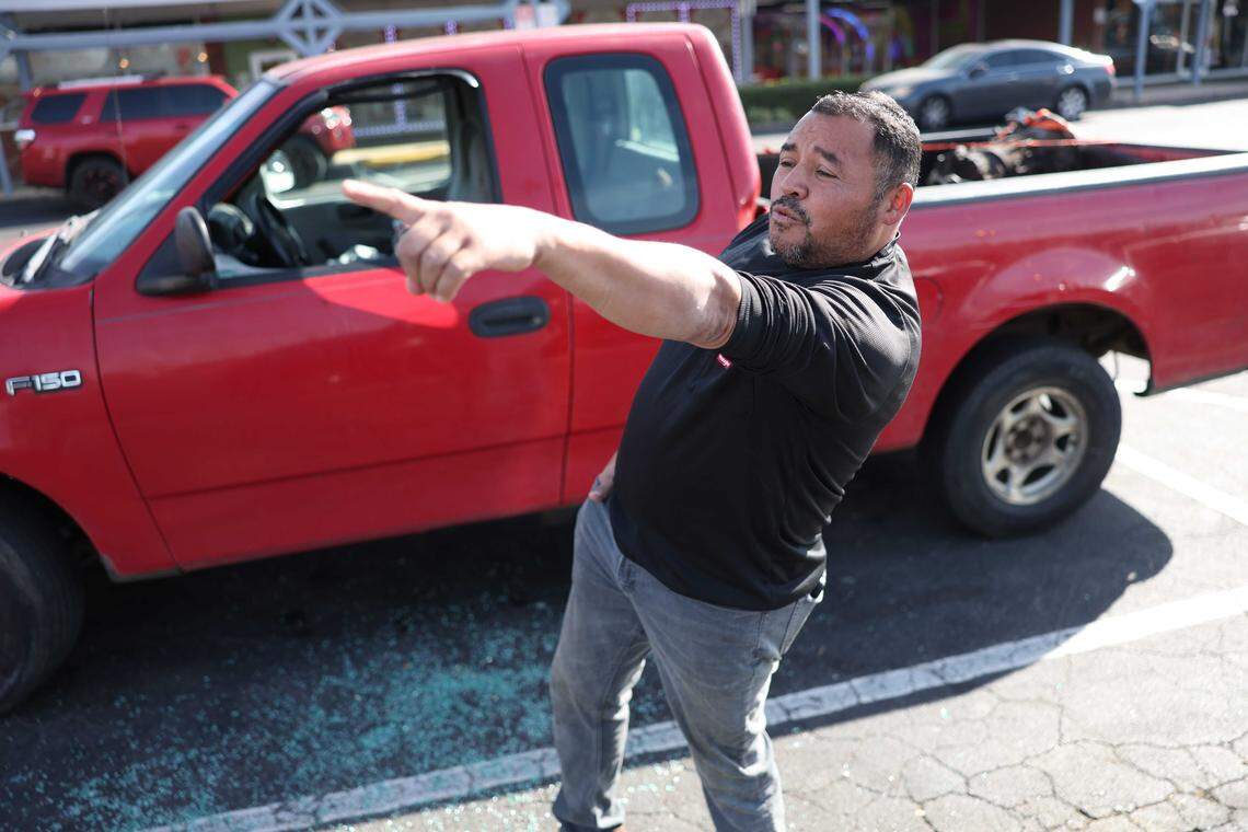 Willy Aceituno points to where U.S. Border Patrol agents were headed on Saturday morning after a confrontation with him at Pollo Campero restaurant near the intersection of South Boulevard and Archdale Drive. He said agents attempted to arrest him twice and smashed his car window when he tried to leave.