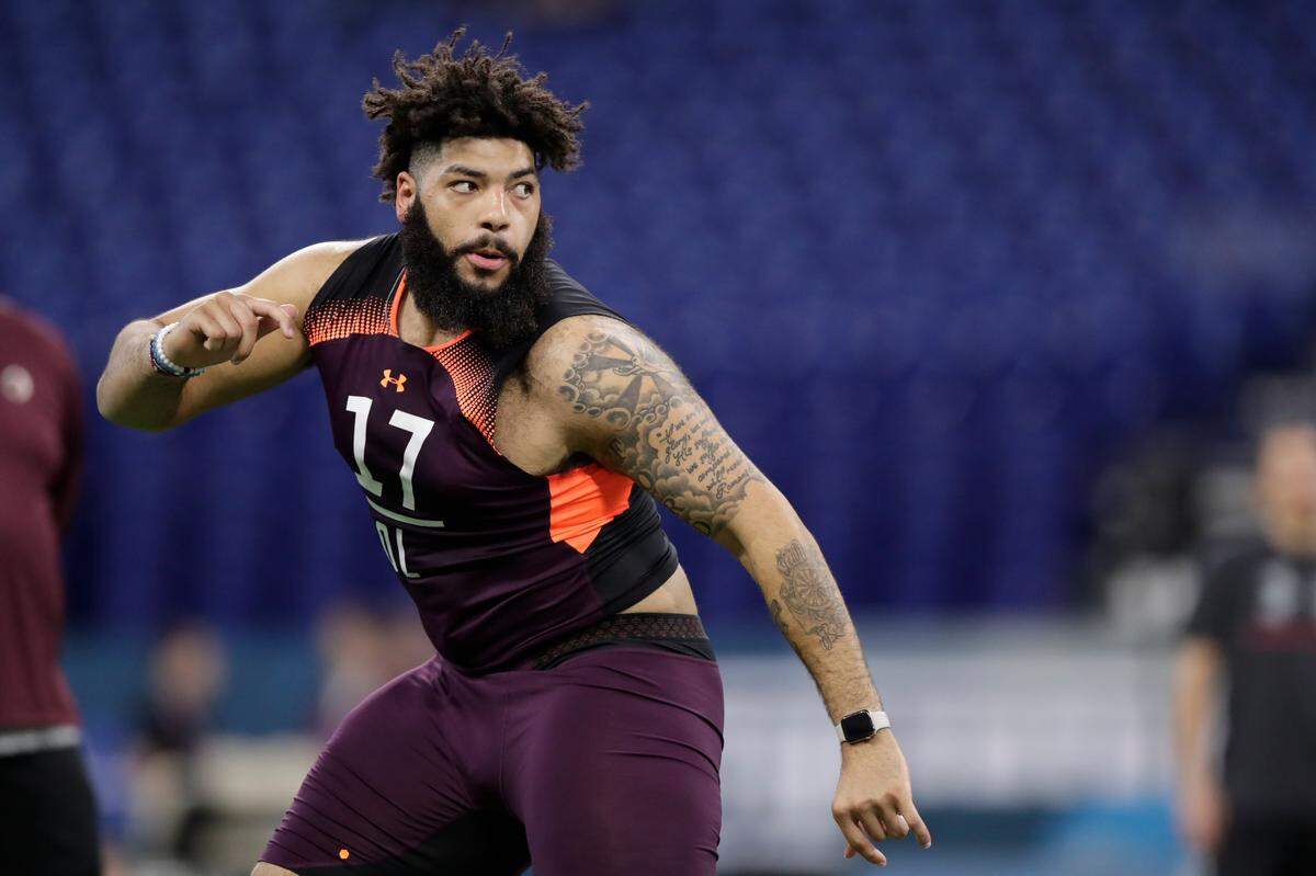 Oklahoma offensive lineman Cody Ford runs a drill at the NFL football scouting combine in Indianapolis, Friday, March 1, 2019. (AP Photo/Michael Conroy)