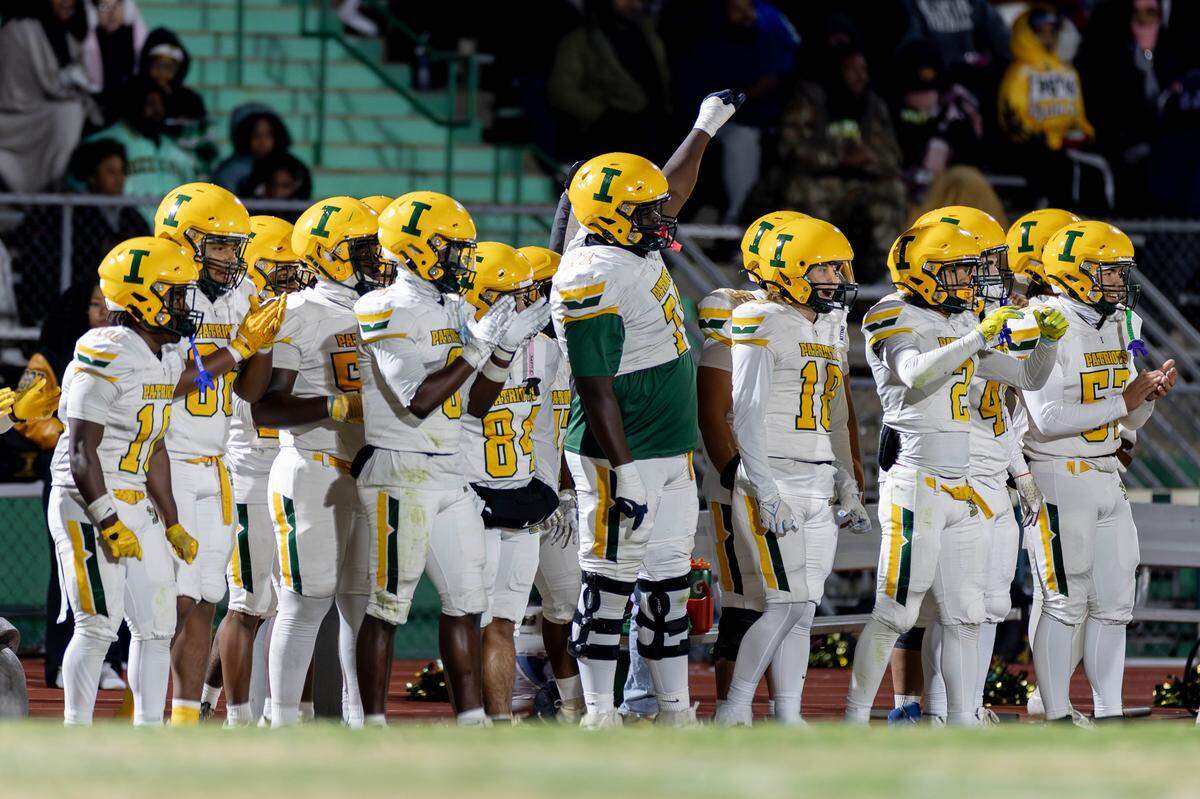 The Patriot sideline celebrate a turnover during 1st half action. Weddington would host Independence in the NCHSAA quarterfinal playoff game Friday, November, 28 2025.