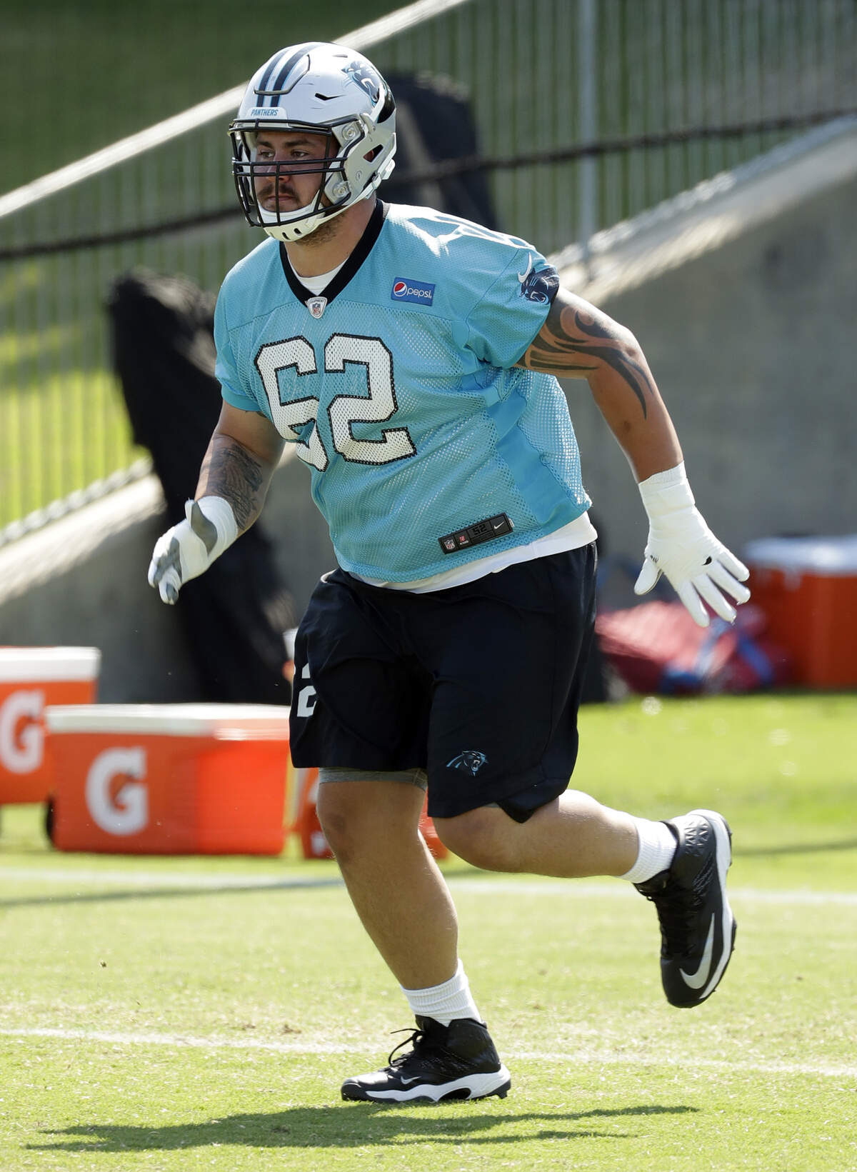 Carolina Panthers rookie Taylor Hearn (62) rhas good size, but it's hard to tell much else in a non-contact rookie camp. (/)