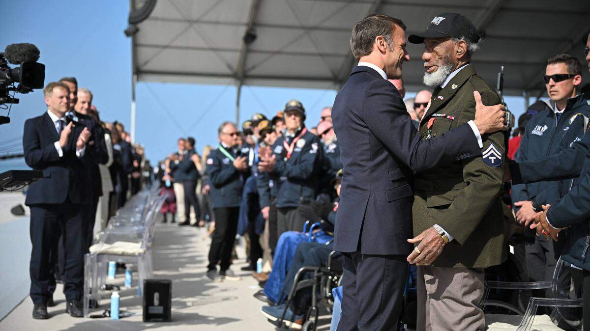 French President Emmanuel Macron awards the Legion d’honneur to U.S. WWII veteran Arlester Brown at the D-Day Anniversary International Ceremony at Omaha Beach, Normandy, France on June 6 2024, as part of 80th anniversary of D-Day.