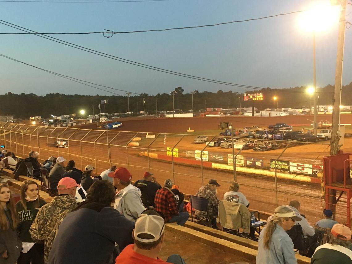 Fans watch a Super Late Models race at the Talladega Short Track in Alabama for the track’s final event of the season. The state has allowed stands to be filled at 50 percent capacity, but track officials said they have been under the allotted capacity all season. Face masks are not required.