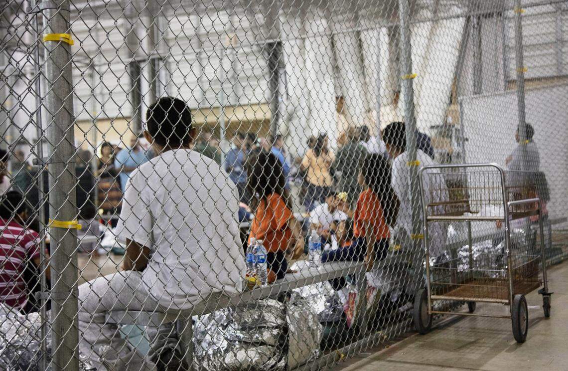 Adults and children who have been taken into custody for illegal entry into the United States sit in one of the cages at a facility in McAllen, Texas. "The Trump administration's policy of separating immigrant children from their parents . . . is a cruel and deliberate practice designed to sow fear and panic in migrant communities," Democratic Rep. David Price of Chapel Hill said.