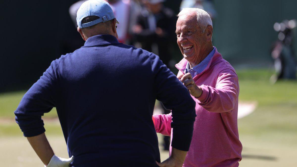 Roy Williams, right, shares a laugh with David Tepper at the 15th hole at the Wells Fargo Championship Pro-Am in Charlotte, N.C., on Wednesday, May 3, 2023.