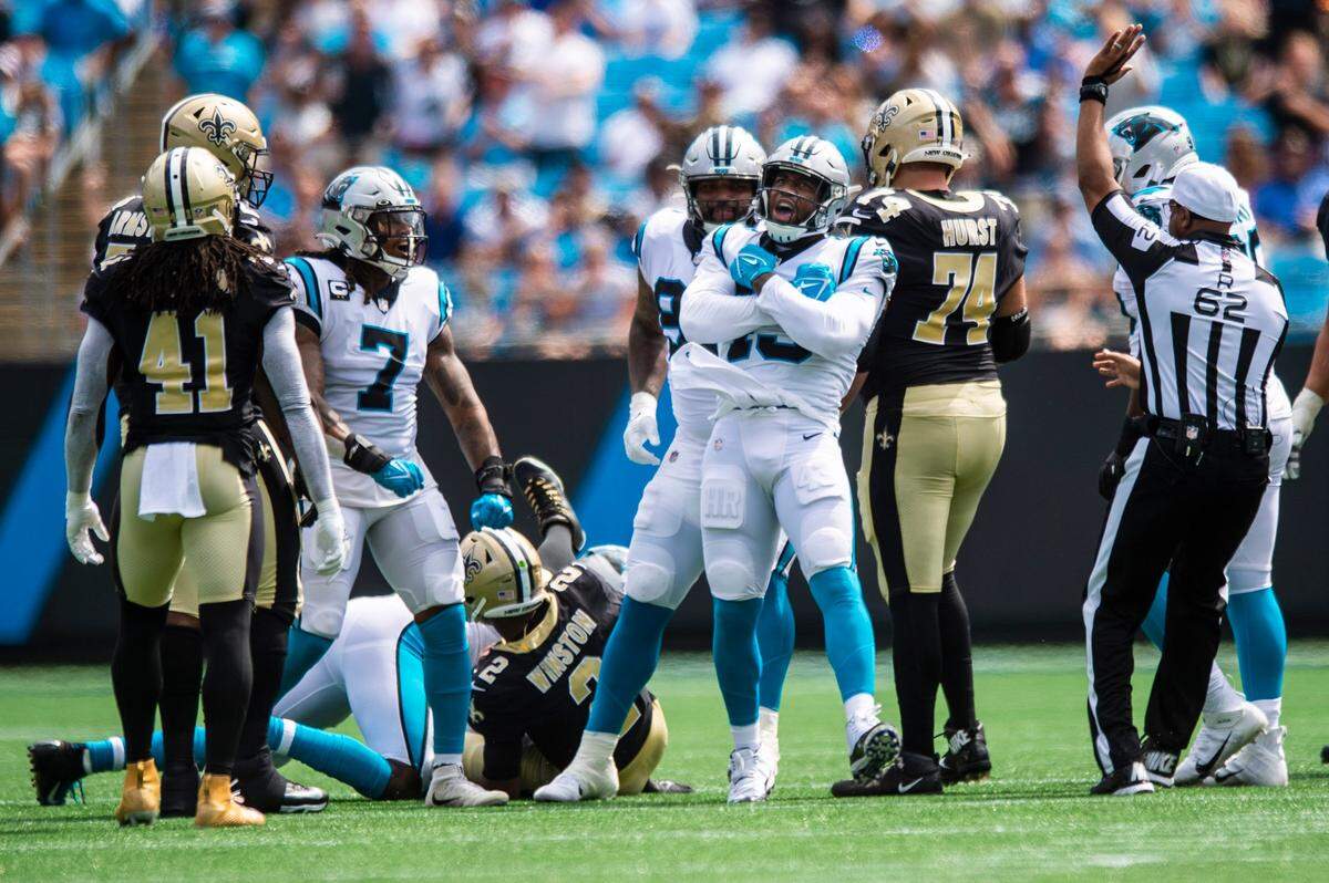 Panthers outside linebacker Haason Reddick, front center, celebrates after a sack against New Orleans. The Panthers lead the NFL with 10 sacks after two games.