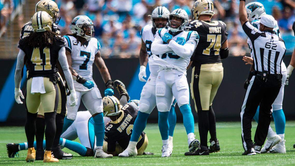 Panthers outside linebacker Haason Reddick, front center, celebrates after a sack of Saints quarterback Jameis Winston during Carolina’s 26-7 win over New Orleans on Sunday.