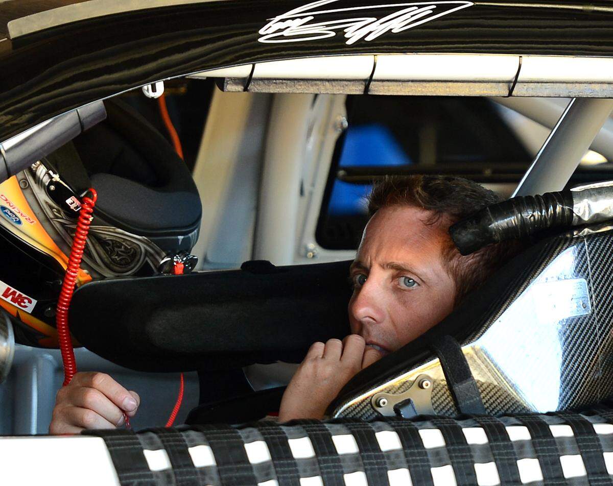 NASCAR Sprint Cup Series driver Greg Biffle sits in his car waiting to begin practice on Wednesday, February 19, 2014 at Daytona International Speedway. 