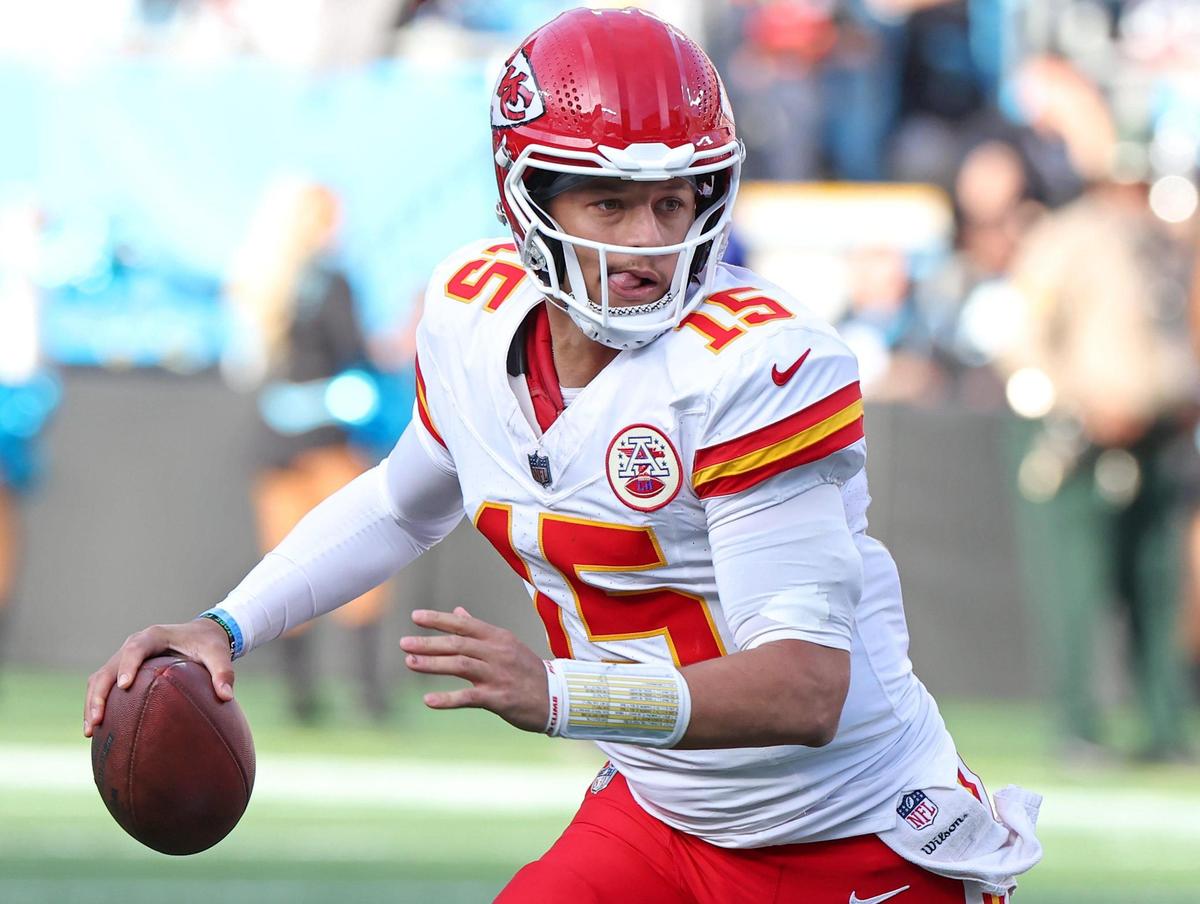 Kansas City Chiefs quarterback Patrick Mahomes rolls out of the pocket during action against the Carolina Panthers at Bank of America Stadium in Charlotte, NC on Sunday, November 24, 2024. The Chiefs defeated the Panthers 30-27.