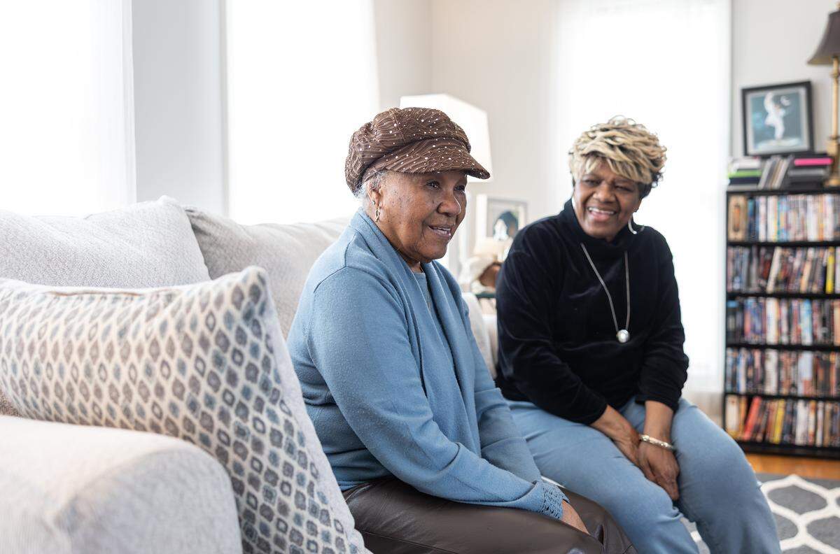 Esther Carter-Buie, left, and her daughter Gwen Carter-Adamson share a laugh as they talk about their life in Charlotte before they were displaced by I-77 in the 1960s in High Point, N.C., on Friday, March 20, 2026. 
