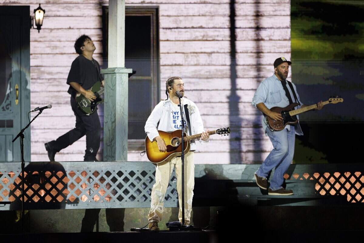 Noah Kahan and his band on stage at Carter-Finley Stadium on Saturday night.