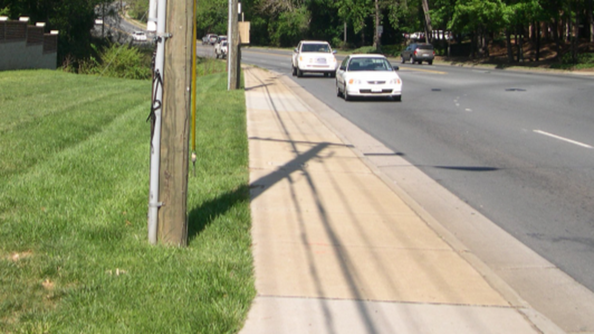 Charlotte is trying to replace "back-of-curb" sidewalks that are adjacent to the street. It wants sidewalks to be separated from the street with grass, trees or plants.