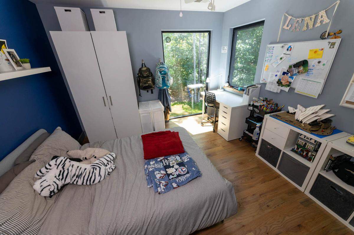 A second-floor bedroom packed with storage.