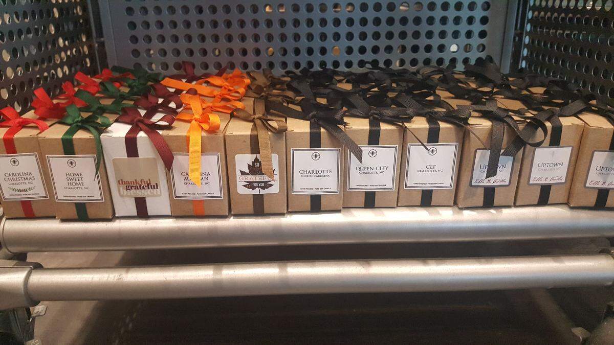 On The Square in Concourse C stocks locally poured, Charlotte-themed Ella B. Candles.