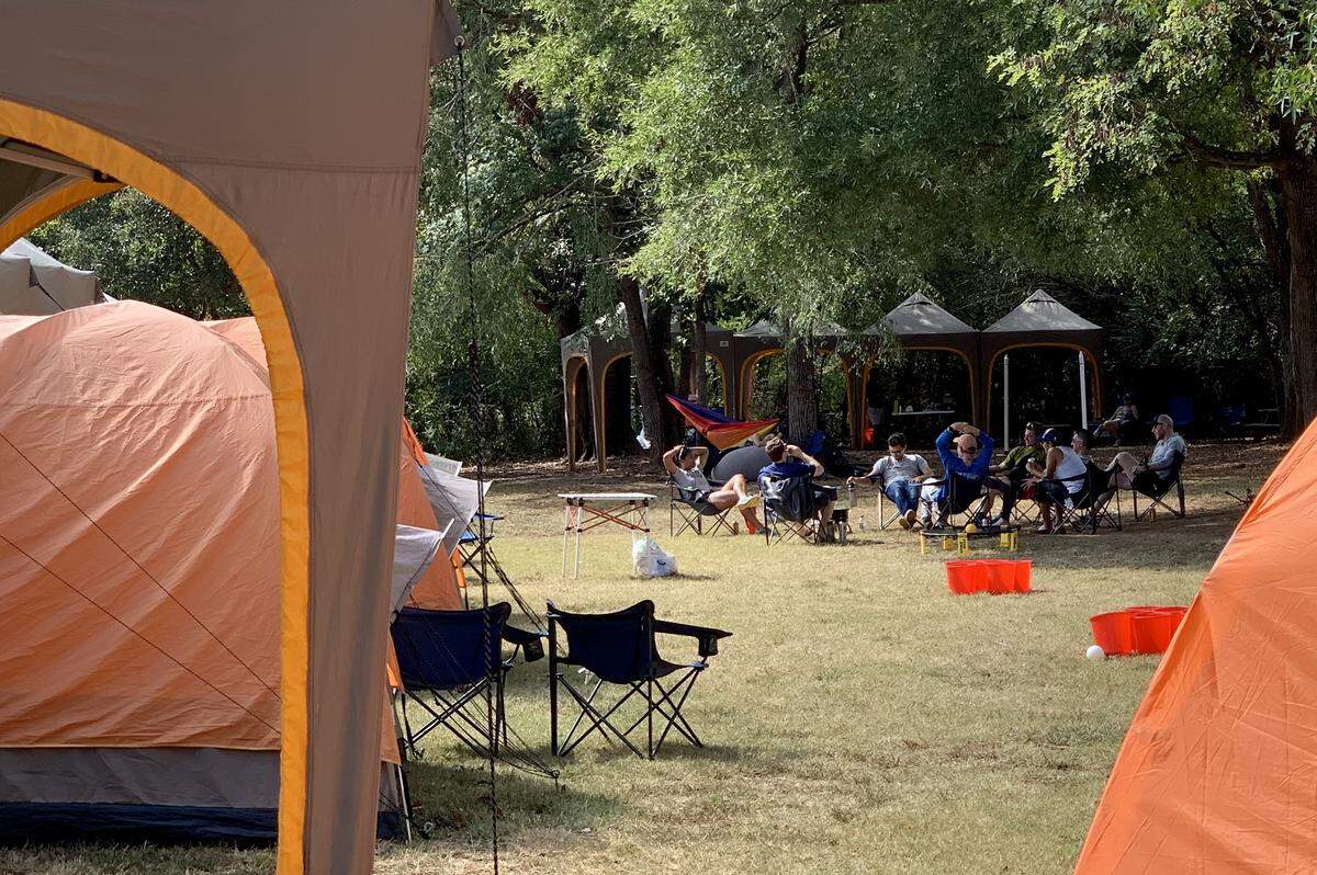 Between running legs of the Ragnar Trail Carolinas, runners enjoy relaxing at their campsites with old and new friends.