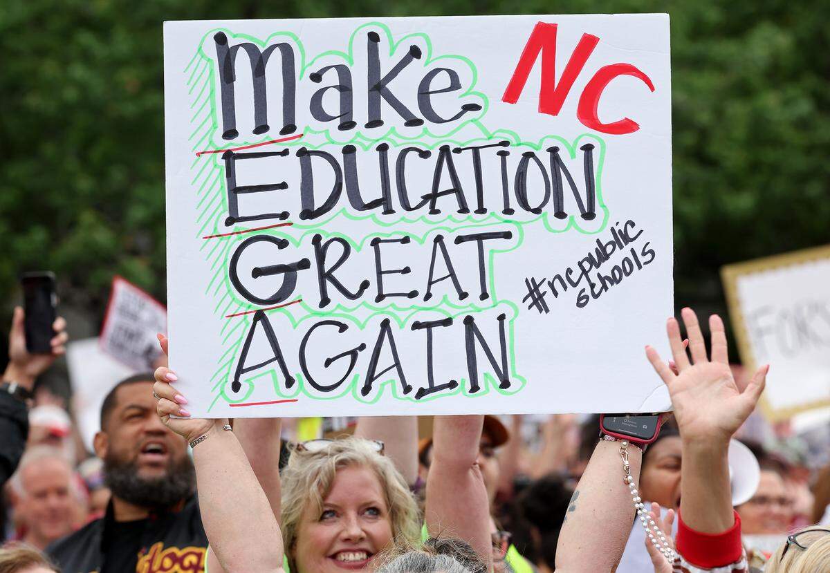 Signs, signs, signs were everywhere as teachers rallied at the Government Complex in Raleigh.