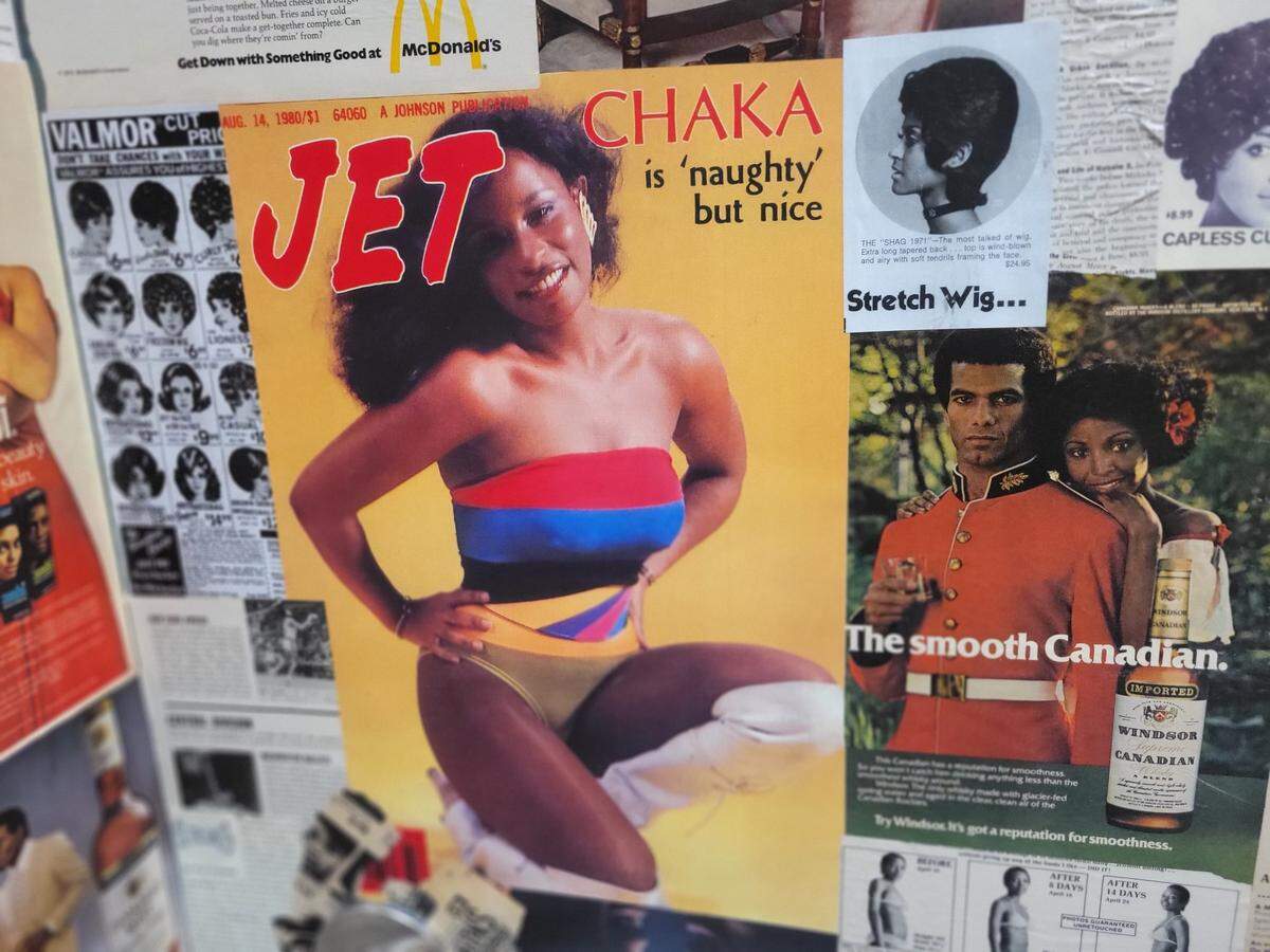 The bathroom at Archive is papered with Black magazine covers and advertisements.