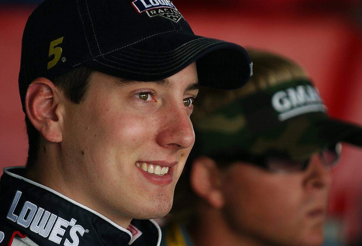 2/12/04 (L) Busch driver Kyle Busch enjoys some down time in the garage area at Daytona International Speedway following practice Thursday morning with (R)Ricky Hendrick. JEFF SINER/STAFF