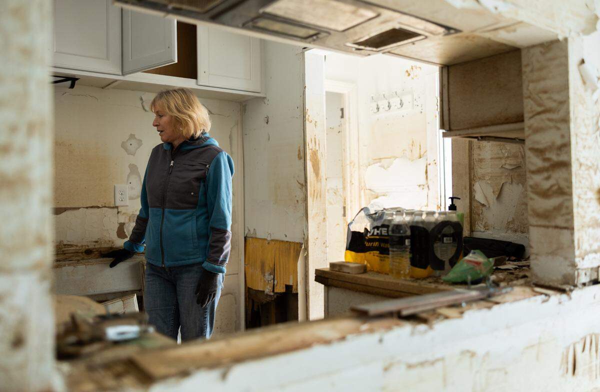 “I haven’t been able to sleep. I haven’t eaten right. I can’t think straight. It just made me crazy,” says Susan Covington, photographed in her ruined home last month, of the impact of the flood on her life.