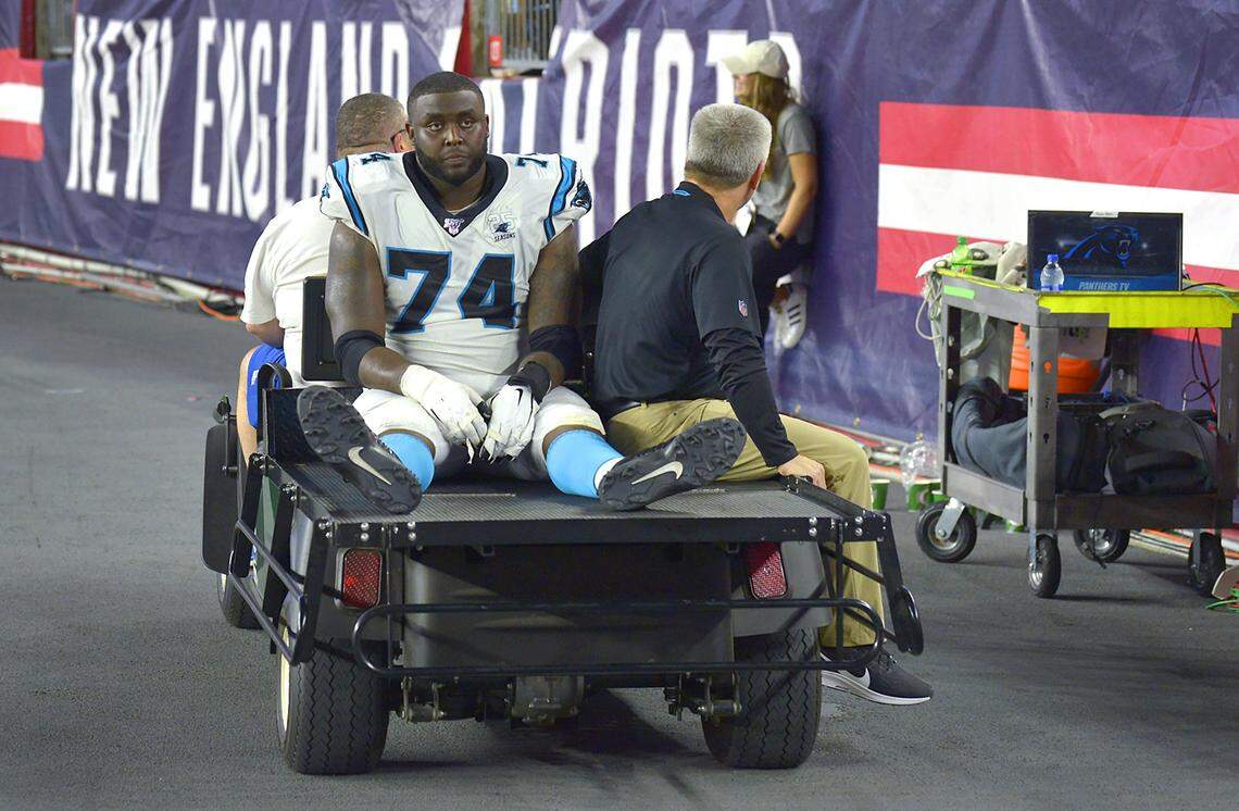 Panthers tackle Greg Little is driven off the field during an Aug. 22 preseason game against New England. Little suffered a concussion in the game and didn’t return to action until a month later against Arizona.