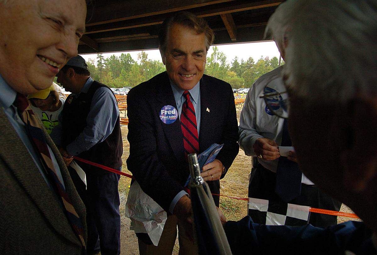 Fred Smith, a candidate for North Carolina governor, shakes hands with folks at the 78th annual Mallard Creek BBQ Thursday, Oct. 25, 2007. 