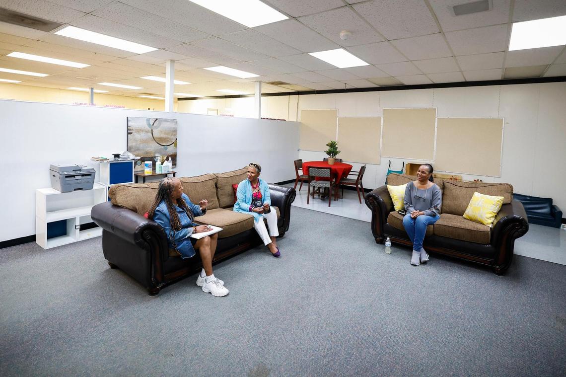 From left, Maria Macon, Camille Stephens and Chevelle Jackson, speak during a weekly Parent Talk Therapy session at the Plaza Road Academy. Stephens founded the non-profit Locked Out Love, which works with youths in the criminal justice system and their families.