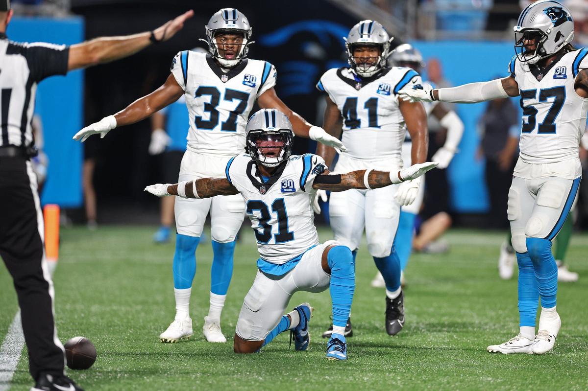 Carolina Panthers cornerback Lamar Jackson, center, and his teammates celebrate his stop of a New York Jets pass attempt into the end zone during fourth quarter action at Bank of America Stadium in Charlotte, NC on Saturday, August 17, 2024. The Jets defeated the Panthers 15-12.