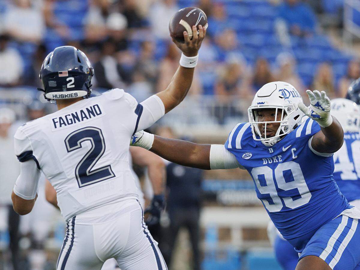 Duke’s Aaron Hall pressures Connecticut’s Joe Fagnano during the first half of the Blue Devils’ game on Saturday, Sept. 14, 2024, at Wallace Wade Stadium in Durham, N.C.